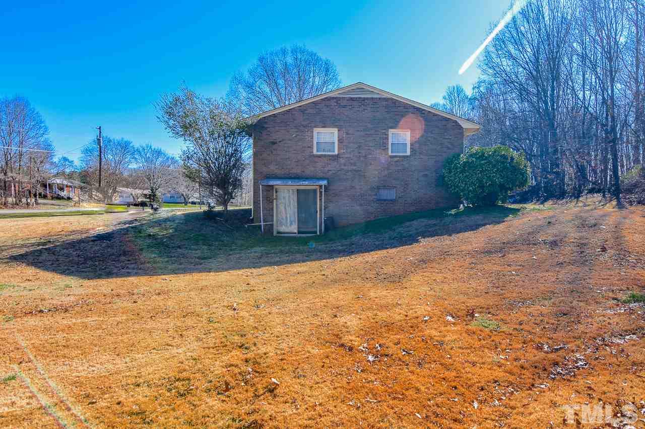 122 Henderson Road Roxboro, NC 27573 - Photo 25 of 27 a front view of a house with a yard