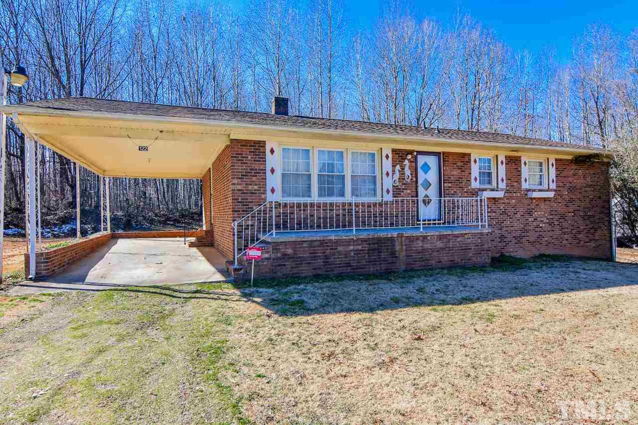 122 Henderson Road Roxboro, NC 27573 - Photo 26 of 27 a view of a backyard