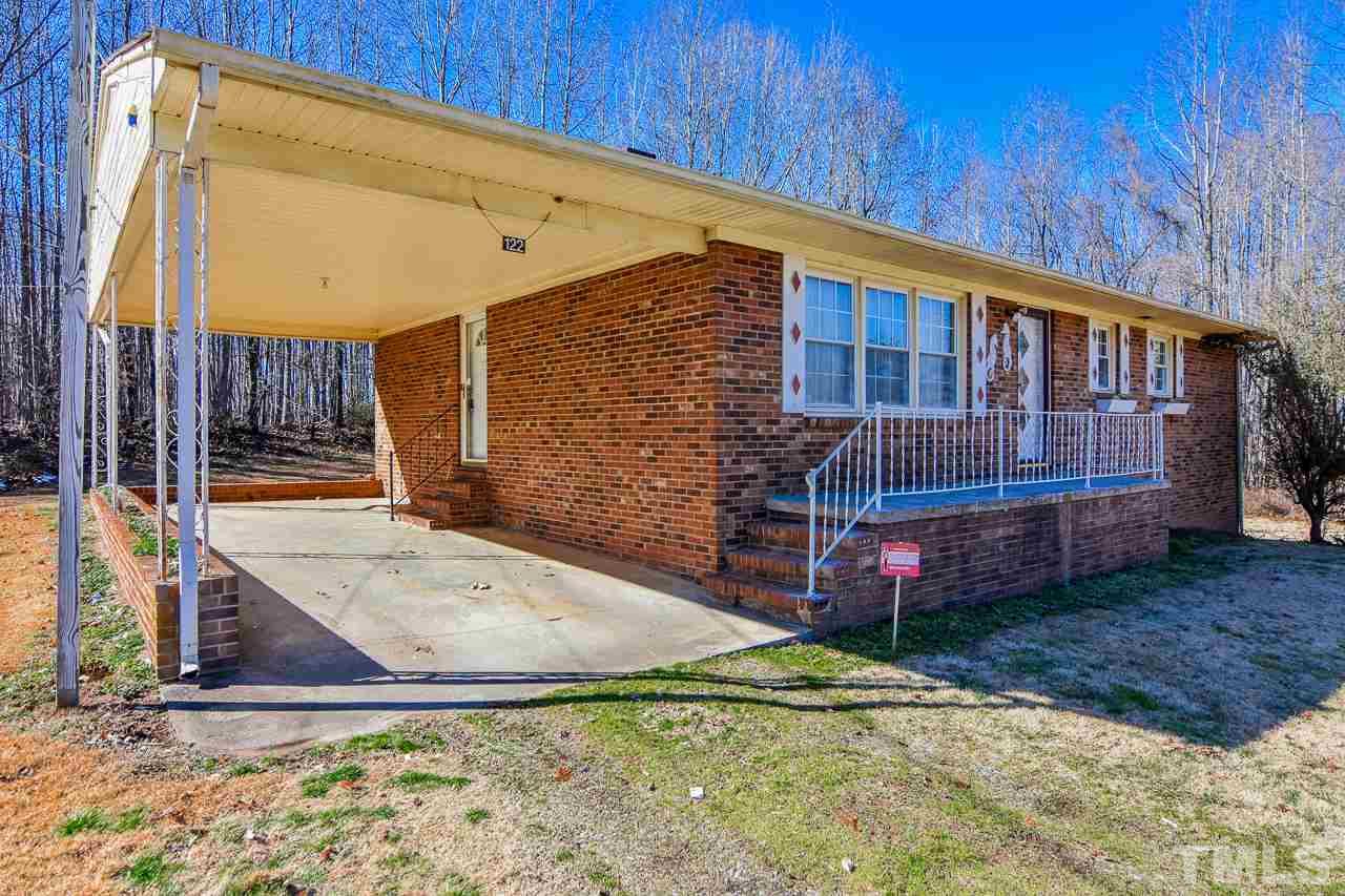 122 Henderson Road Roxboro, NC 27573 - Photo 27 of 27 a view of backyard with deck