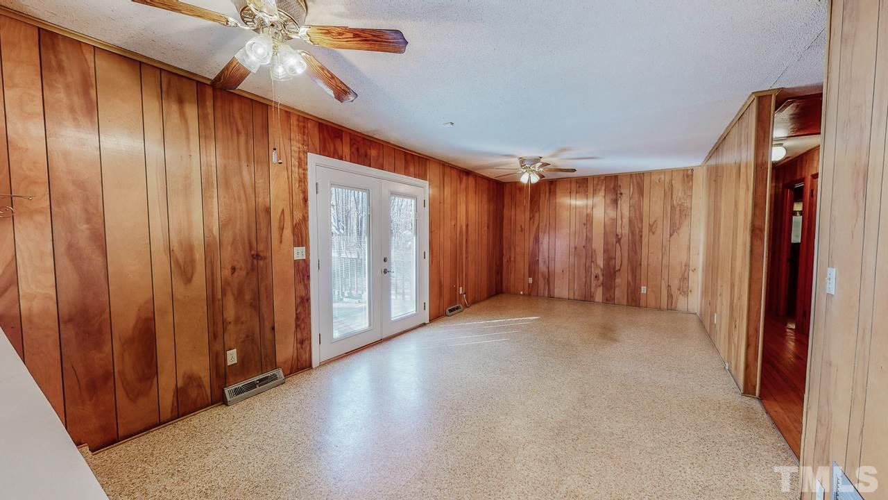 122 Henderson Road Roxboro, NC 27573 - Photo 4 of 27 a view of an empty room with a fan