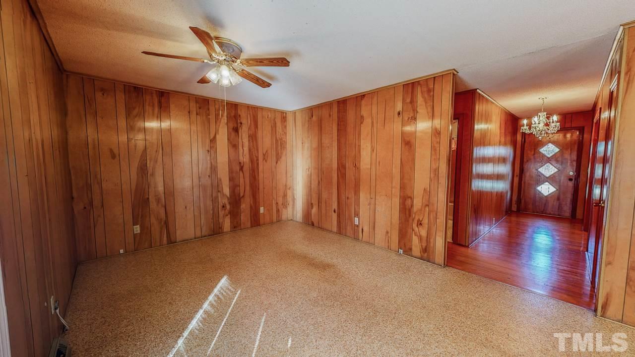 122 Henderson Road Roxboro, NC 27573 - Photo 6 of 27 a view of a livingroom with a furniture wooden floor and window