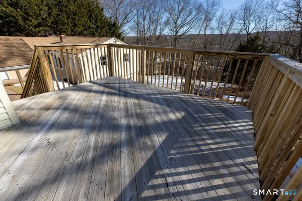 a view of deck with wooden floor and fence