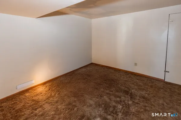 a bathroom with a shower and a toilet