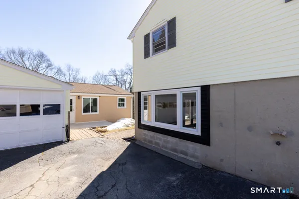 a view of backyard with potted plants