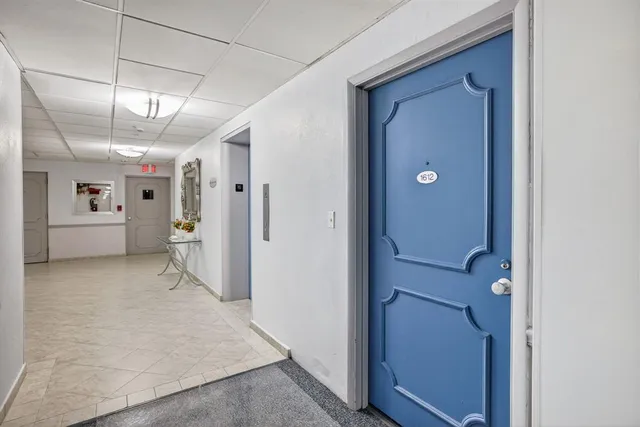 a view of a hallway with closet and entryway