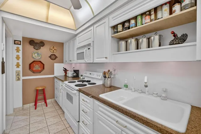 a kitchen with a stove and a cabinets