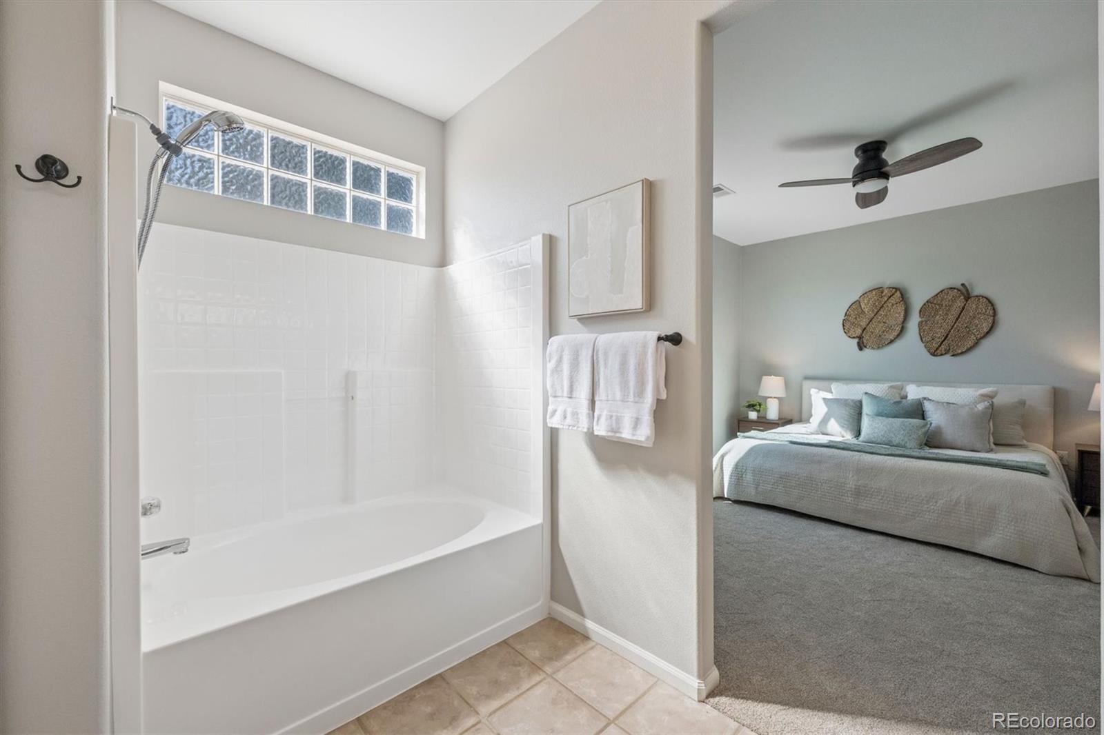 10098 MacKay Drive Highlands Ranch, CO 80130 - Photo 21 of 42 a bathroom with a tub sink and mirror