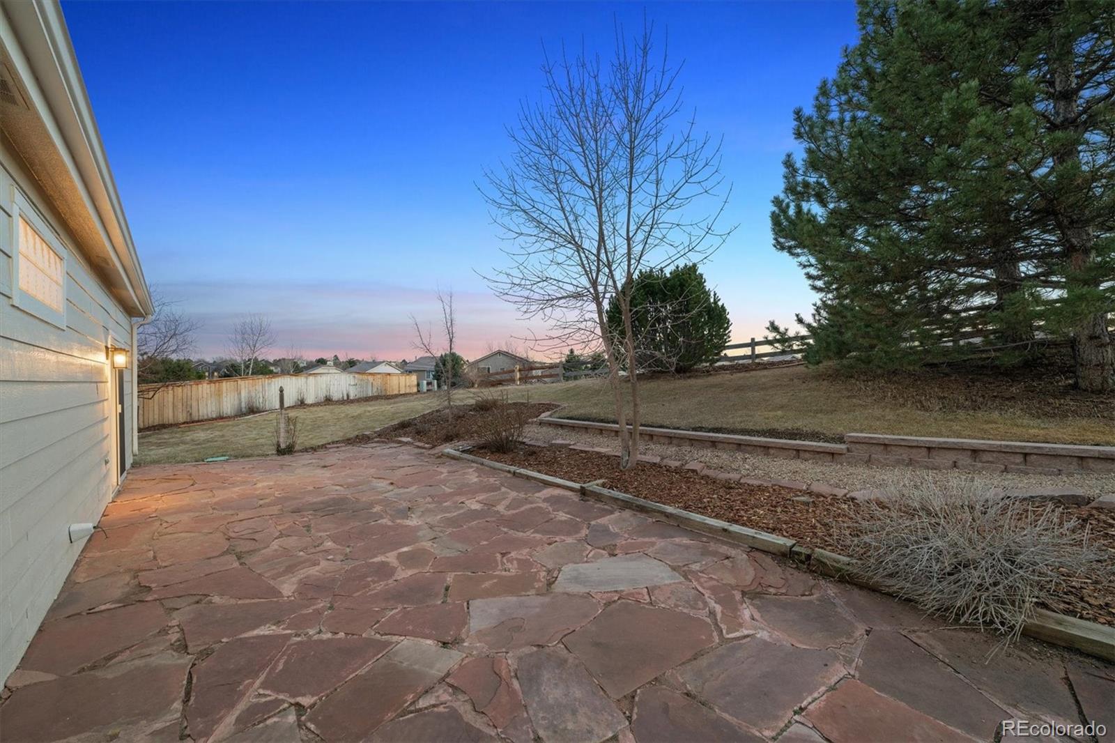 10098 MacKay Drive Highlands Ranch, CO 80130 - Photo 28 of 42 a view of a yard with an empty space
