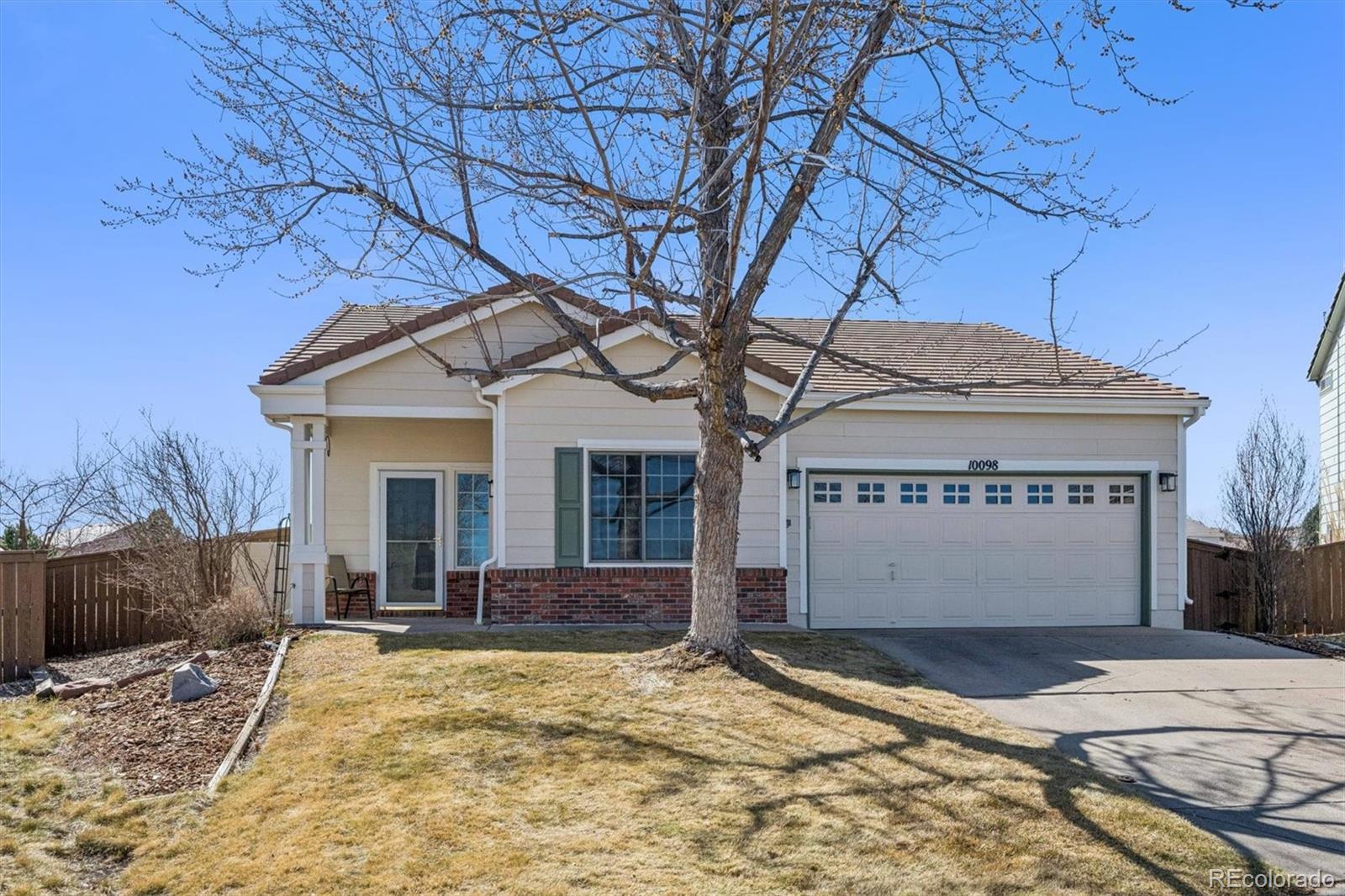 10098 MacKay Drive Highlands Ranch, CO 80130 - Photo 3 of 42 a view of a house with snow on the road