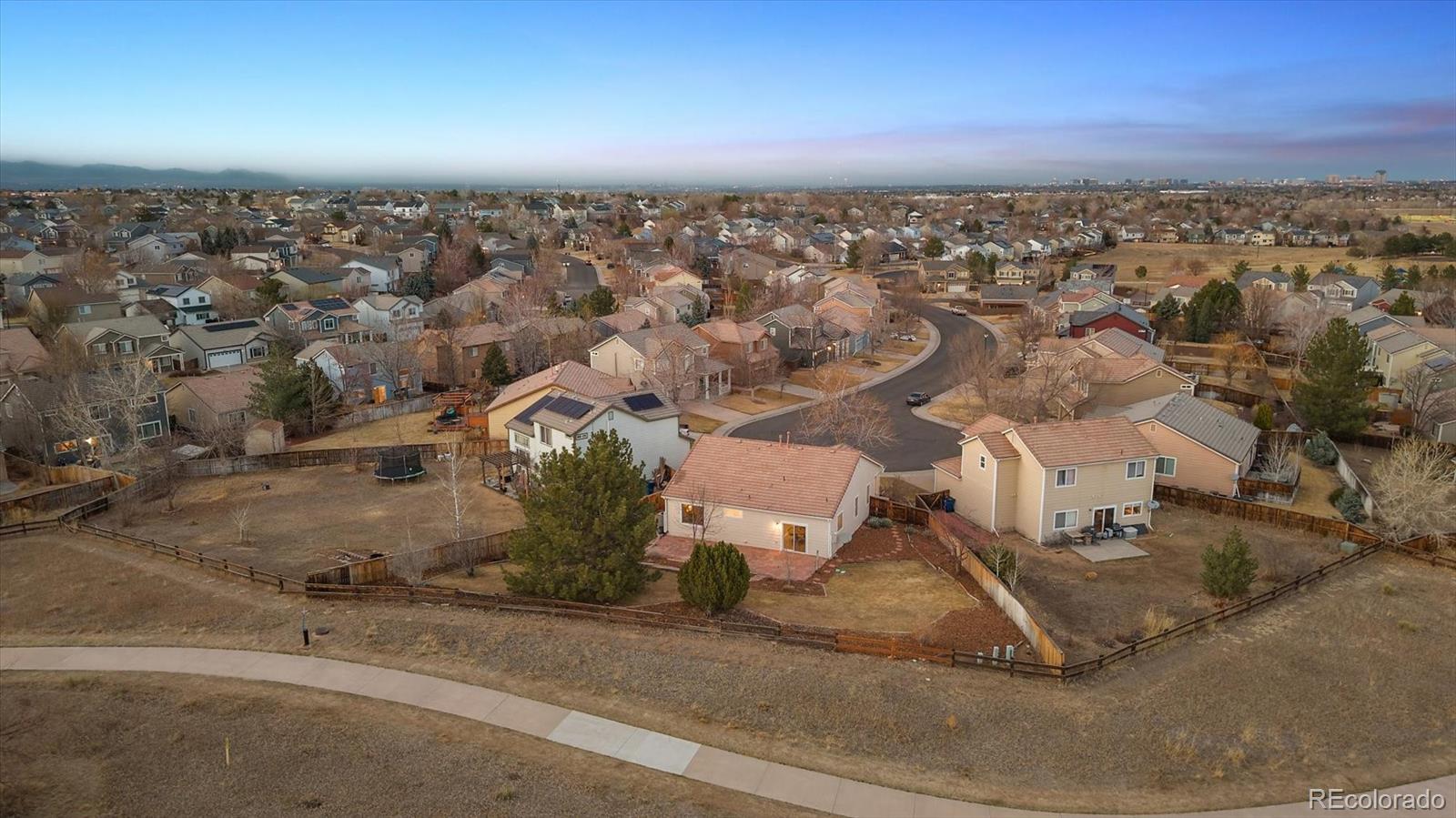 10098 MacKay Drive Highlands Ranch, CO 80130 - Photo 35 of 42 an aerial view of a house with a yard