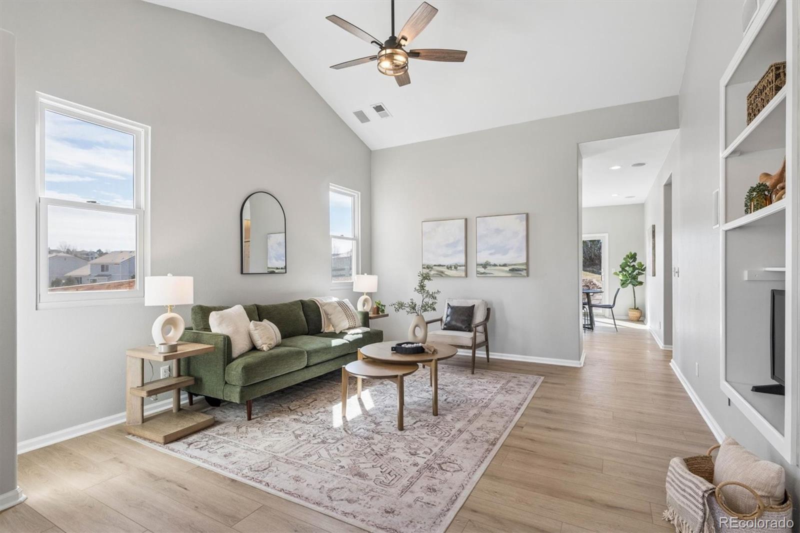 10098 MacKay Drive Highlands Ranch, CO 80130 - Photo 5 of 42 a living room with furniture and a wooden floor