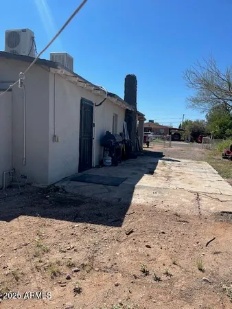 a view of a backyard of the house
