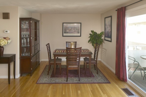 1 Circuit Lane, Unit D Watertown, MA 02472 - Photo 4 of 4 a dining room with furniture and wooden floor
