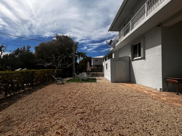 a house with trees in the background