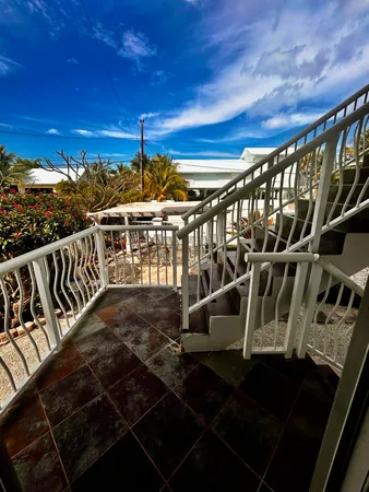 a view of balcony with wooden floor