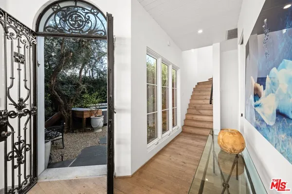 a view of entryway with wooden floor and a rug