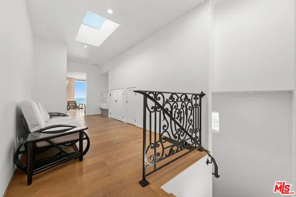 a view of a livingroom with furniture and staircase