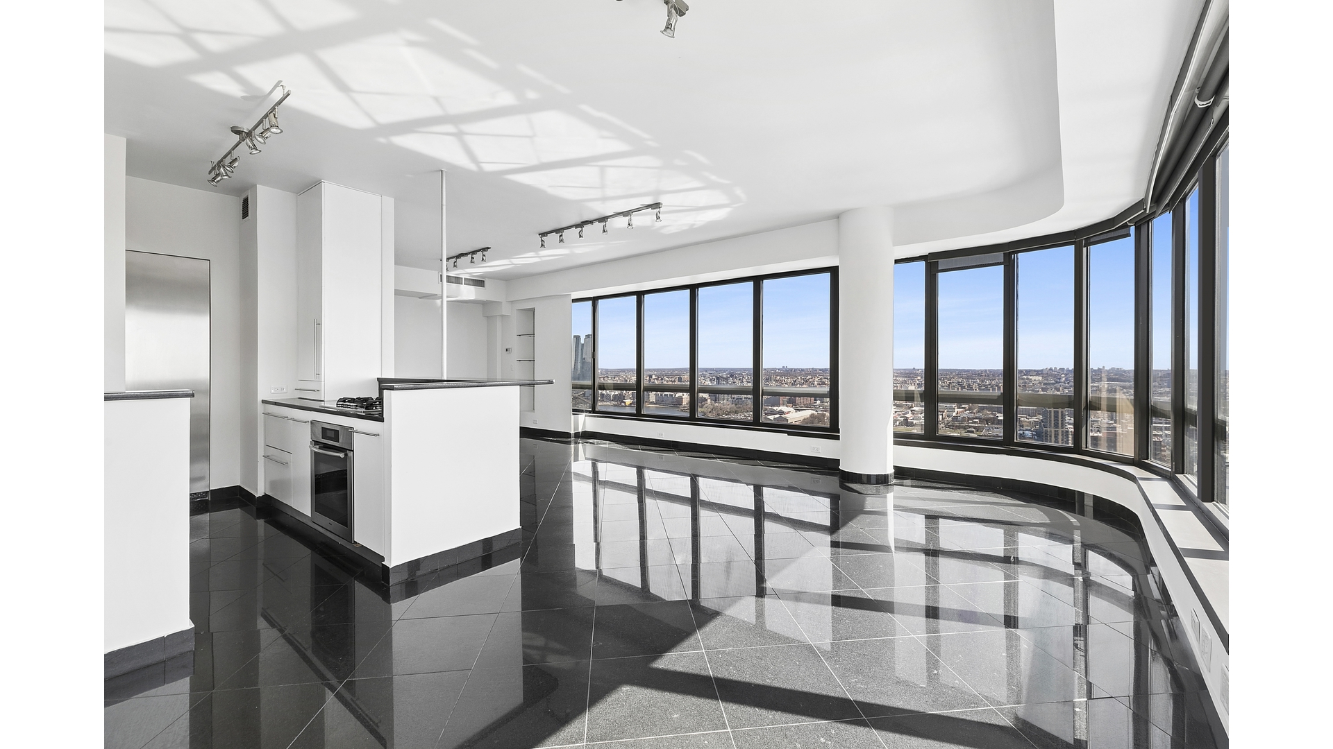 530 East 76th Street, Unit 33H Manhattan, NY 10021 - Photo 4 of 10 a kitchen with stainless steel appliances granite countertop a stove and a refrigerator