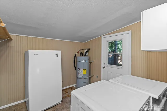 a bedroom with a bed and a mirror