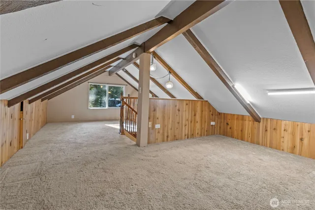 a view of an empty room with stairs