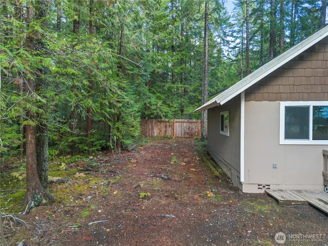 a backyard of a house with lots of green space
