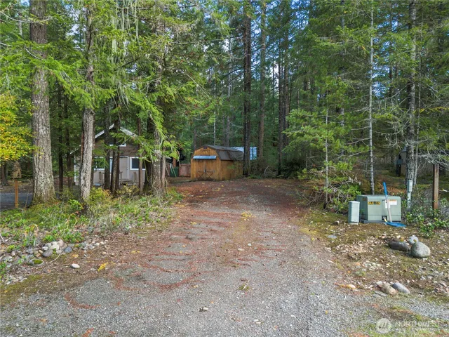 a backyard of a house with lots of green space