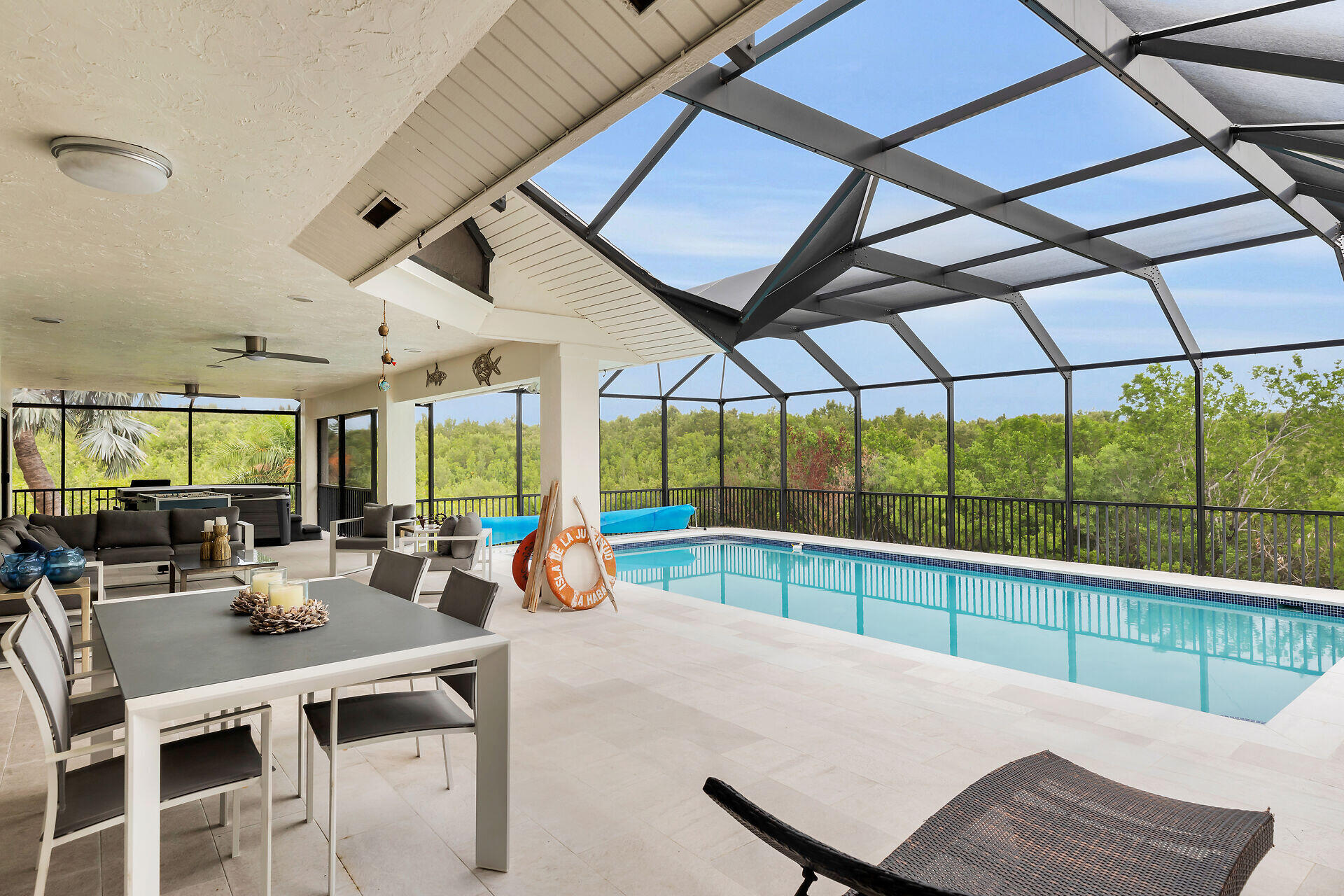 31 South Carysfort Circle Key Largo, FL 33037 - Photo 13 of 47 a view of a dining room with furniture window and outside view