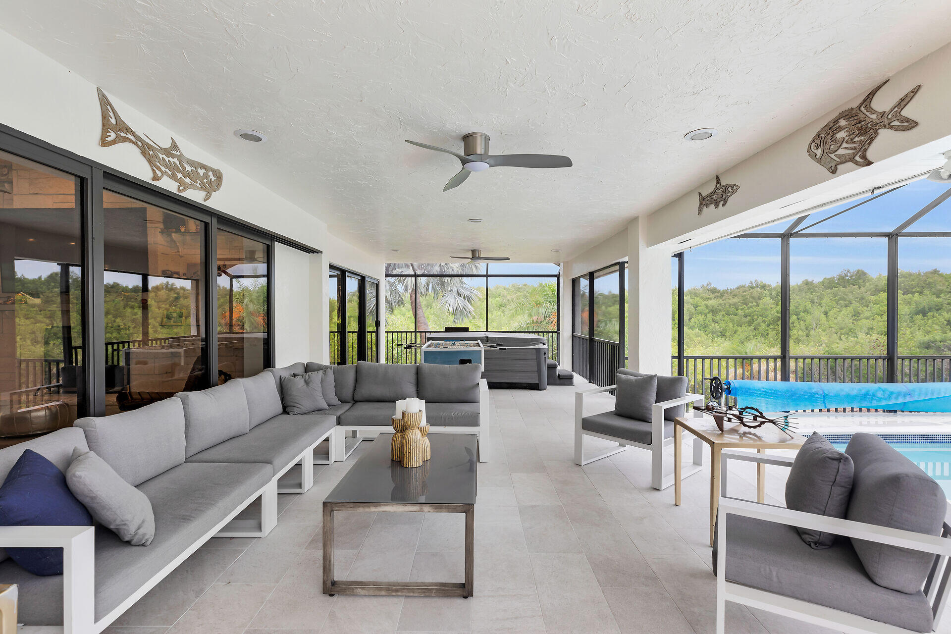 31 South Carysfort Circle Key Largo, FL 33037 - Photo 14 of 47 a living room with furniture and large windows