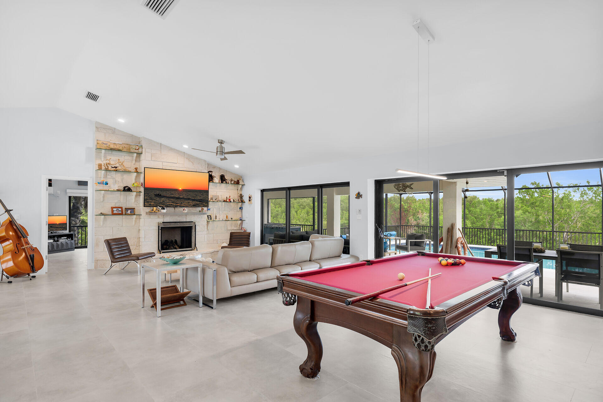 31 South Carysfort Circle Key Largo, FL 33037 - Photo 16 of 47 a living room with furniture pool table and a fireplace