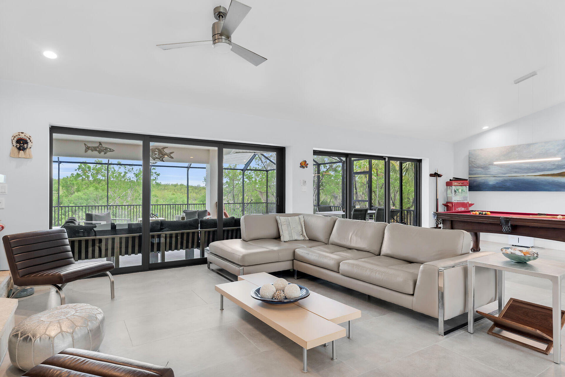 31 South Carysfort Circle Key Largo, FL 33037 - Photo 18 of 47 a living room with furniture and a large window