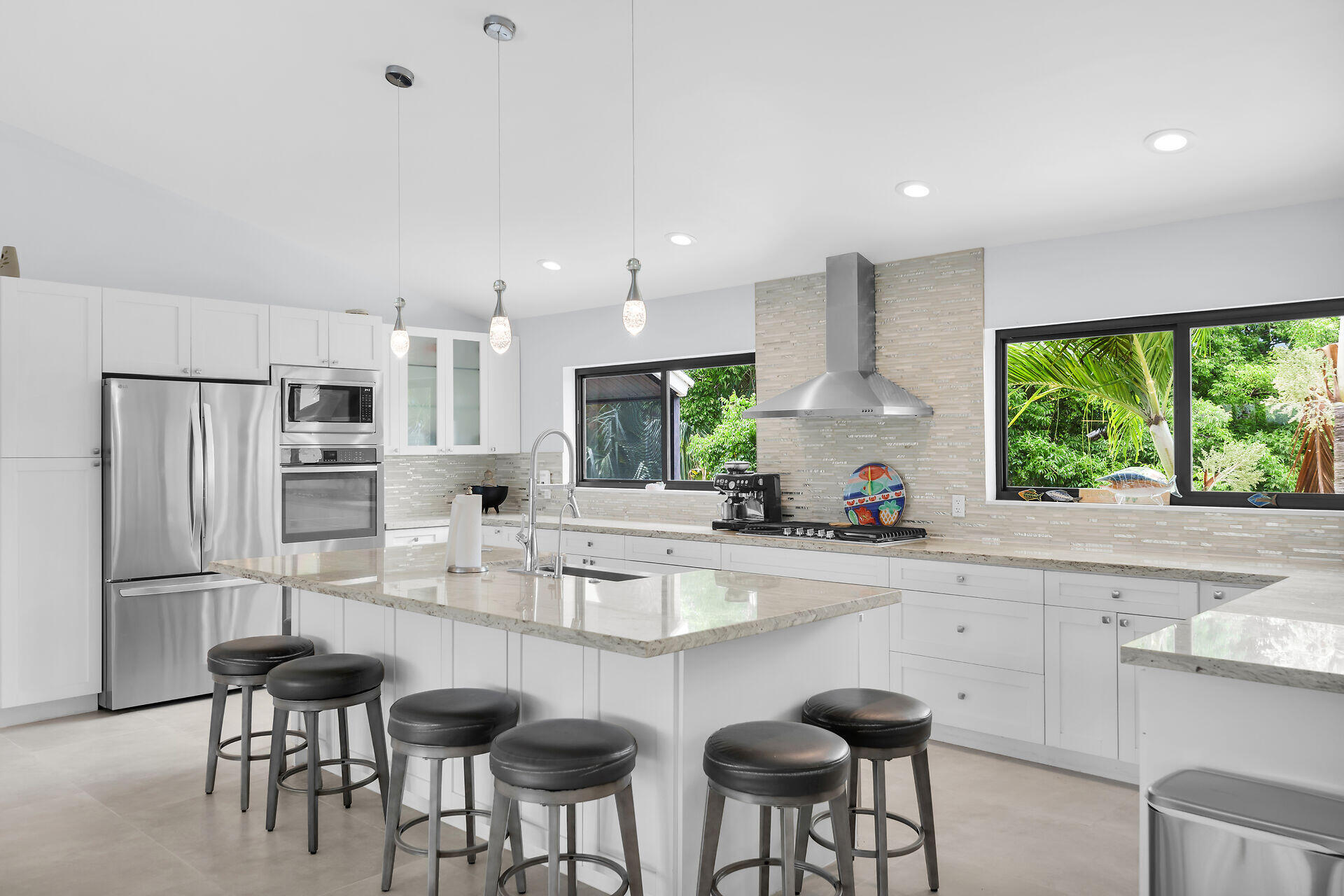 31 South Carysfort Circle Key Largo, FL 33037 - Photo 21 of 47 a kitchen with stainless steel appliances a sink stove and refrigerator