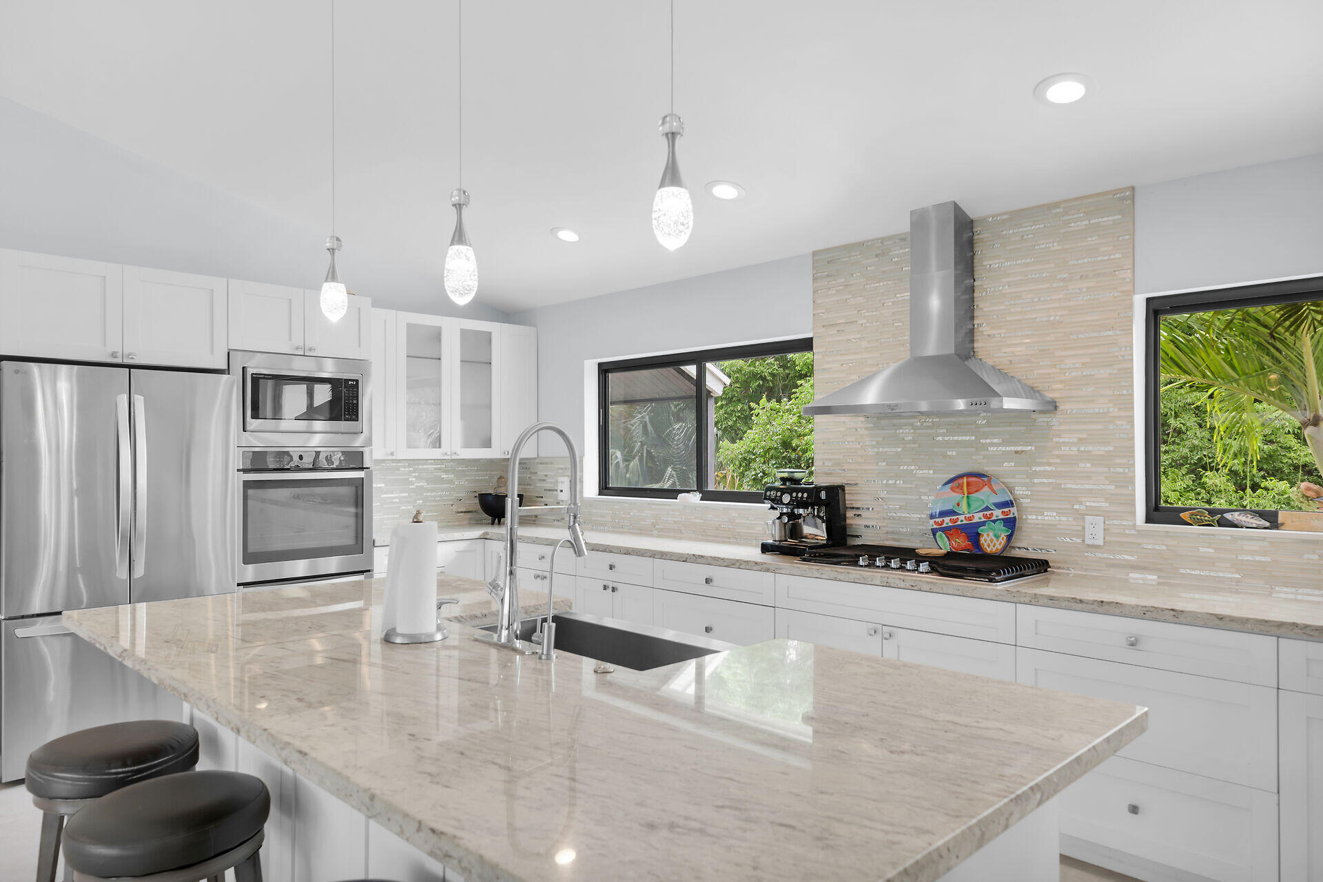 31 South Carysfort Circle Key Largo, FL 33037 - Photo 22 of 47 a kitchen with counter top space cabinets and a potted plant