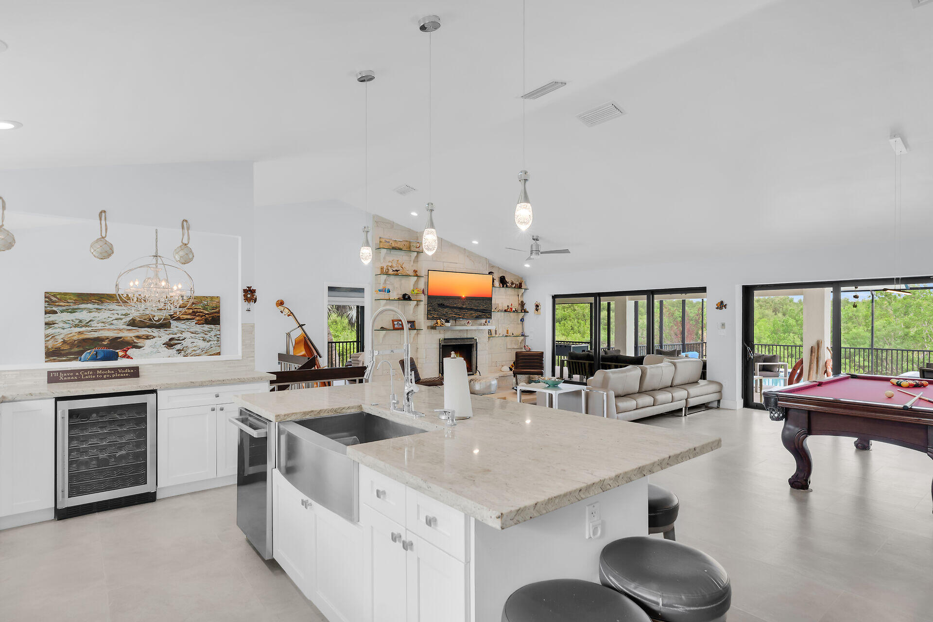 31 South Carysfort Circle Key Largo, FL 33037 - Photo 23 of 47 a kitchen with stainless steel appliances granite countertop a stove and a sink with cabinets
