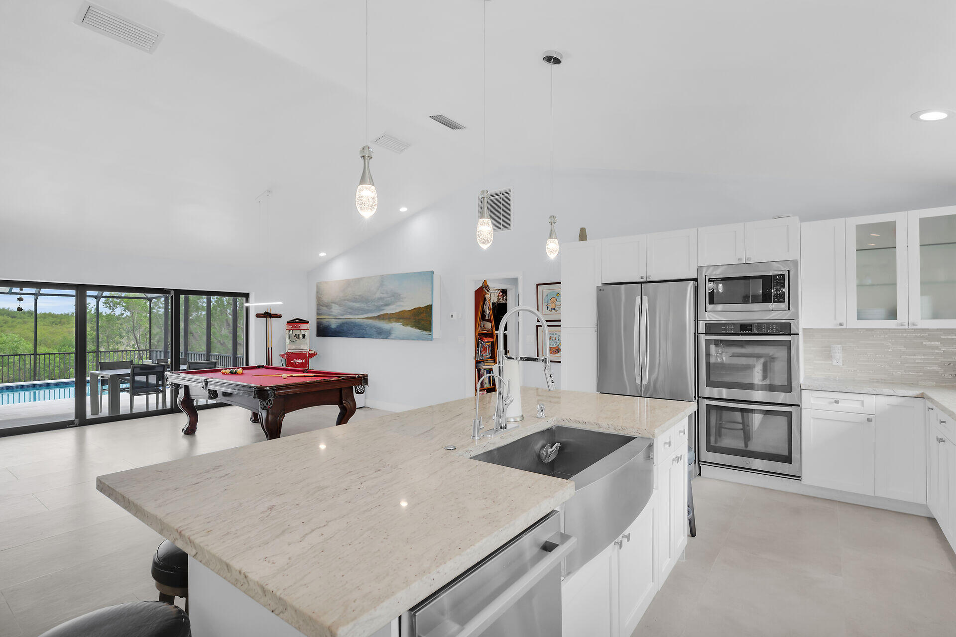 31 South Carysfort Circle Key Largo, FL 33037 - Photo 24 of 47 a kitchen with stainless steel appliances a stove a sink a microwave and a refrigerator