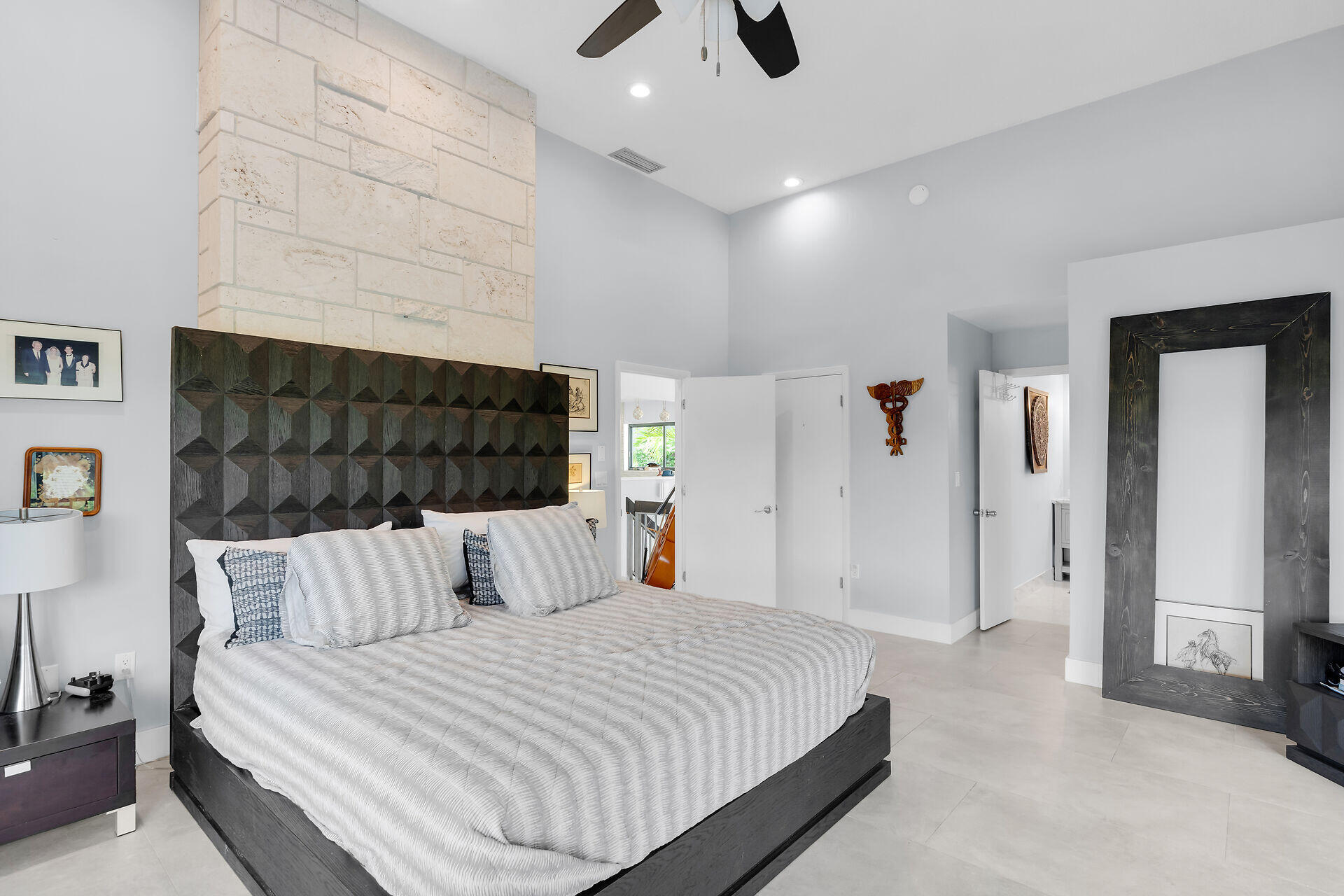 31 South Carysfort Circle Key Largo, FL 33037 - Photo 29 of 47 a bedroom with a bed and a chandelier