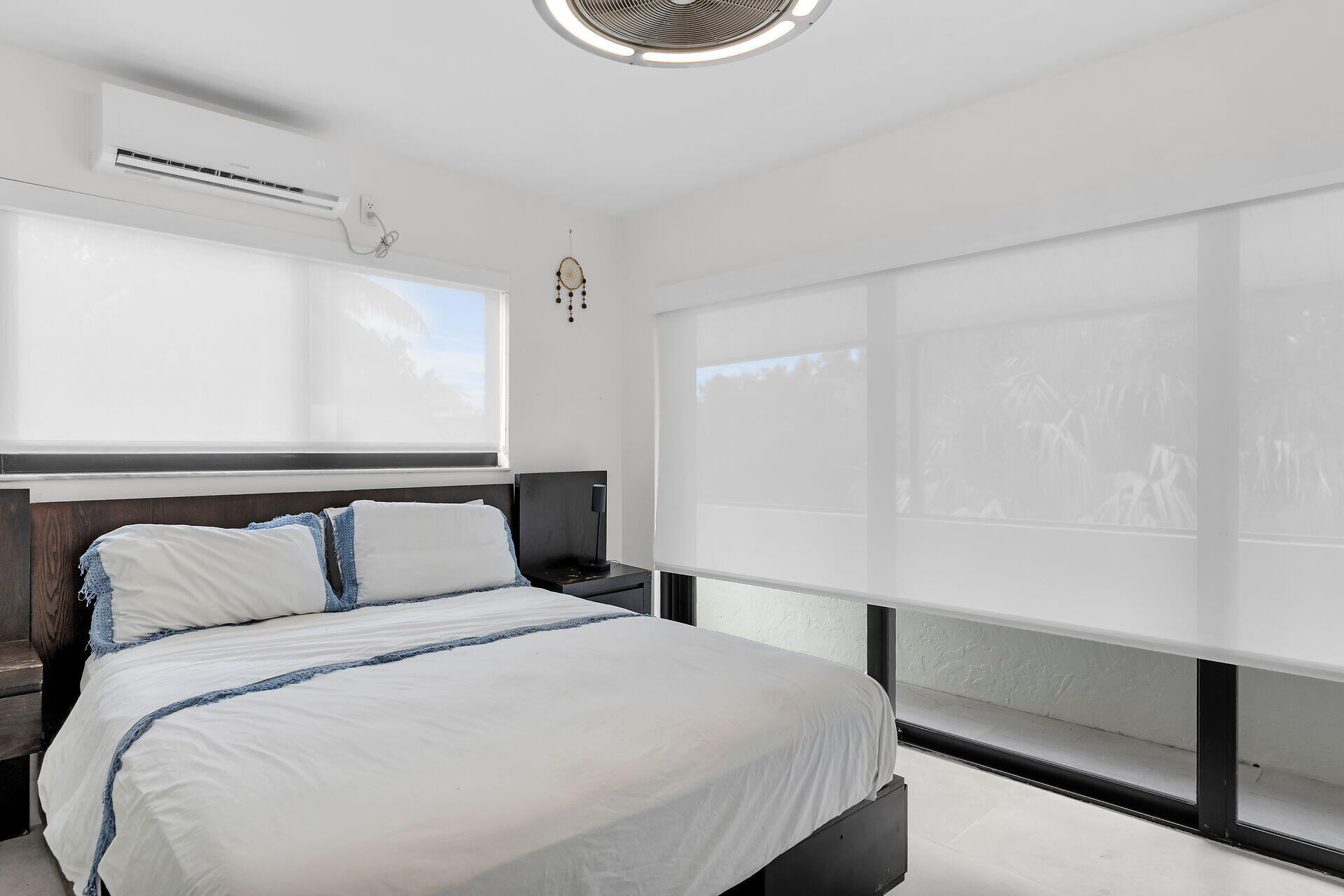 31 South Carysfort Circle Key Largo, FL 33037 - Photo 32 of 47 a bedroom with a bed and a window