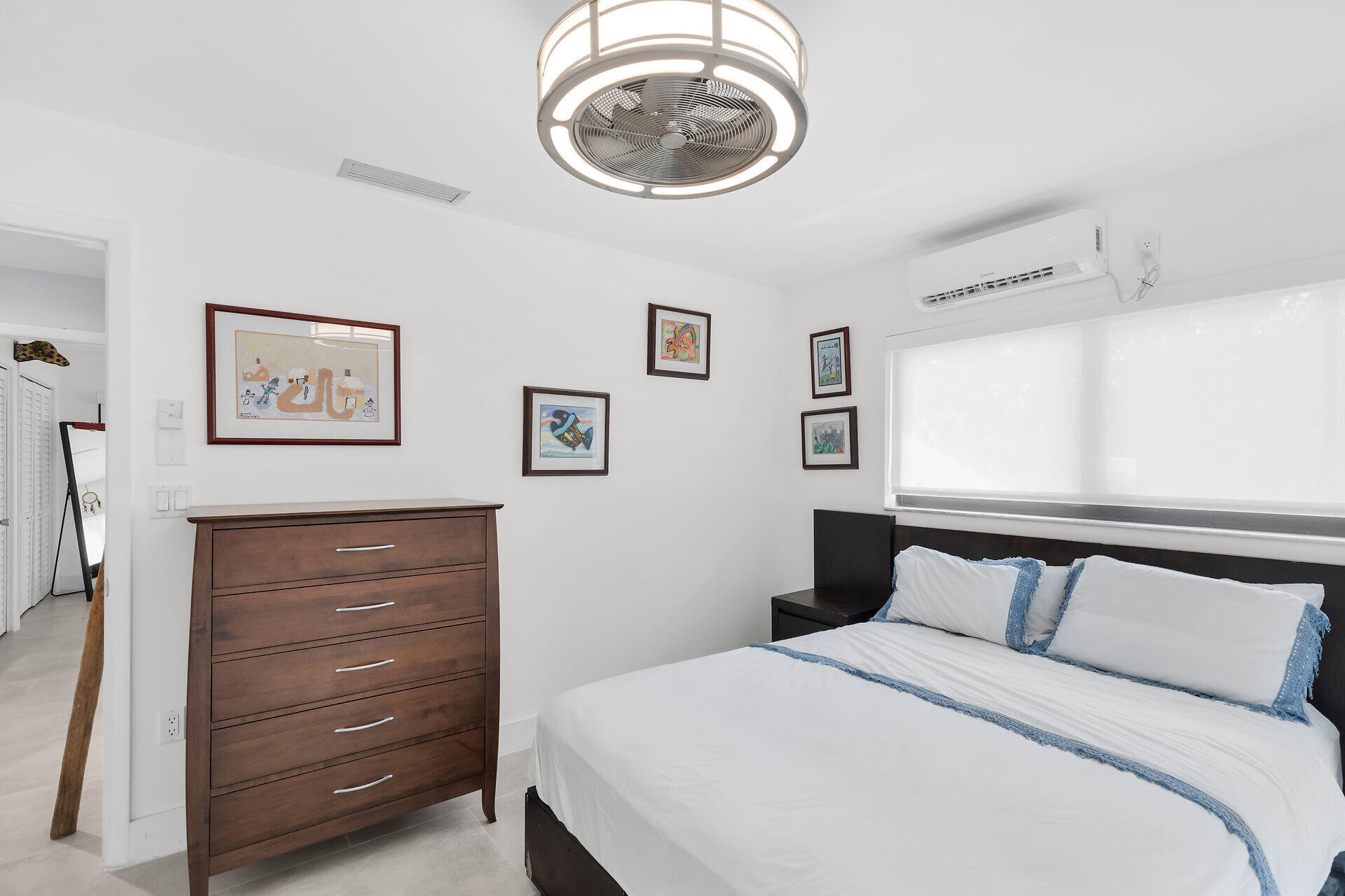 31 South Carysfort Circle Key Largo, FL 33037 - Photo 34 of 47 a bedroom with a bed and a dresser