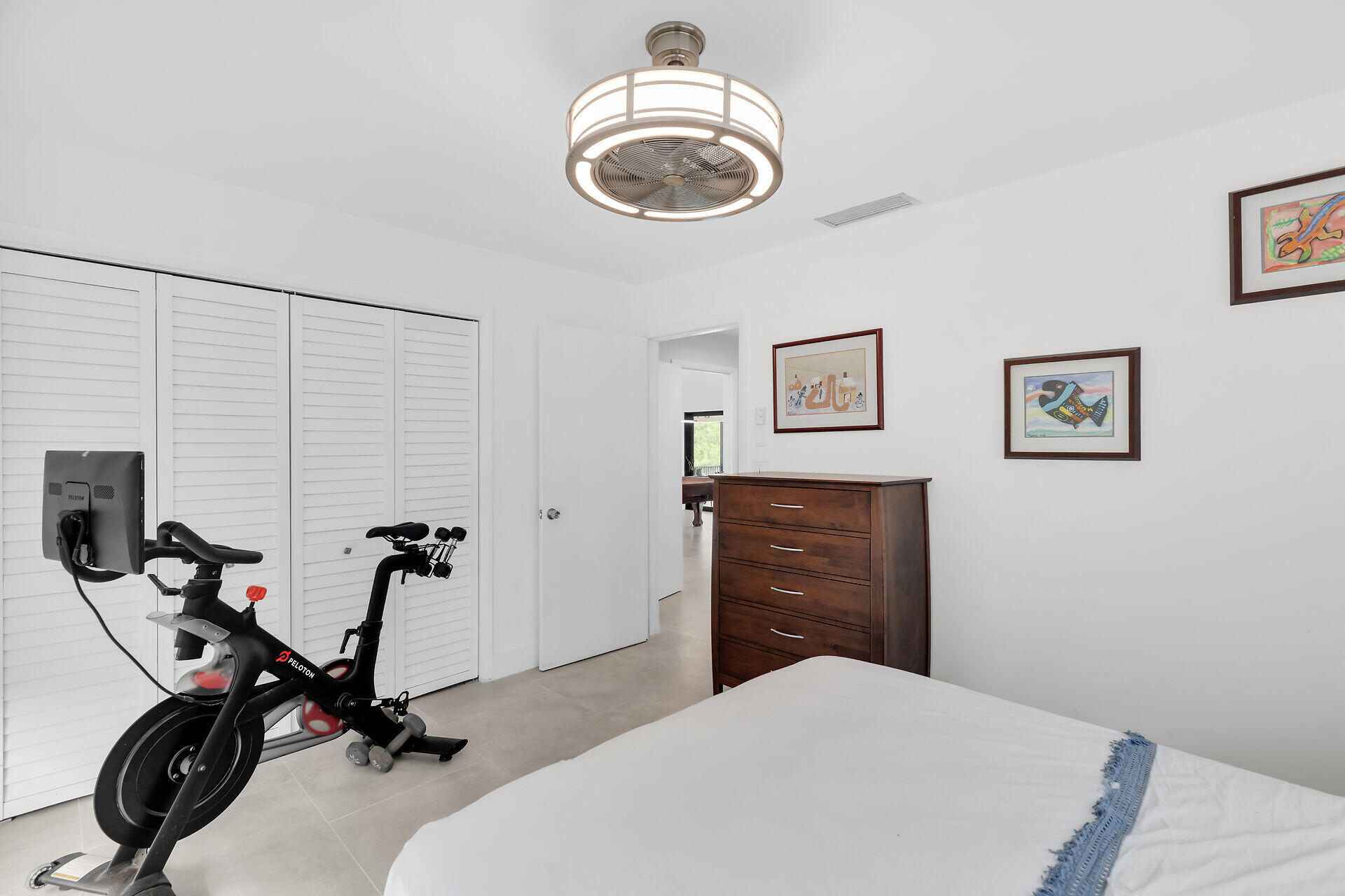 31 South Carysfort Circle Key Largo, FL 33037 - Photo 35 of 47 a bedroom with a bed and a chandelier