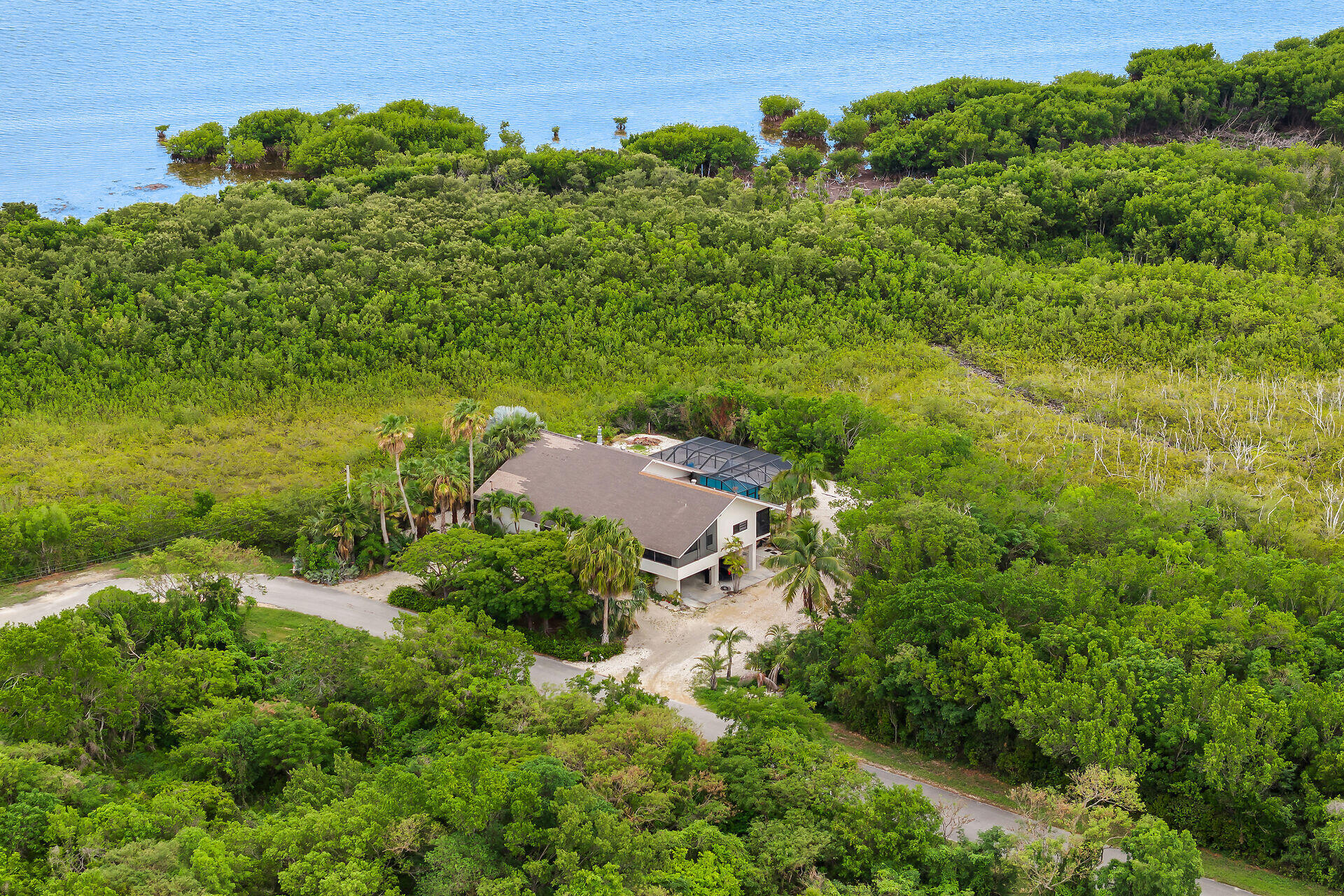 31 South Carysfort Circle Key Largo, FL 33037 - Photo 4 of 47 an aerial view of a house with a yard