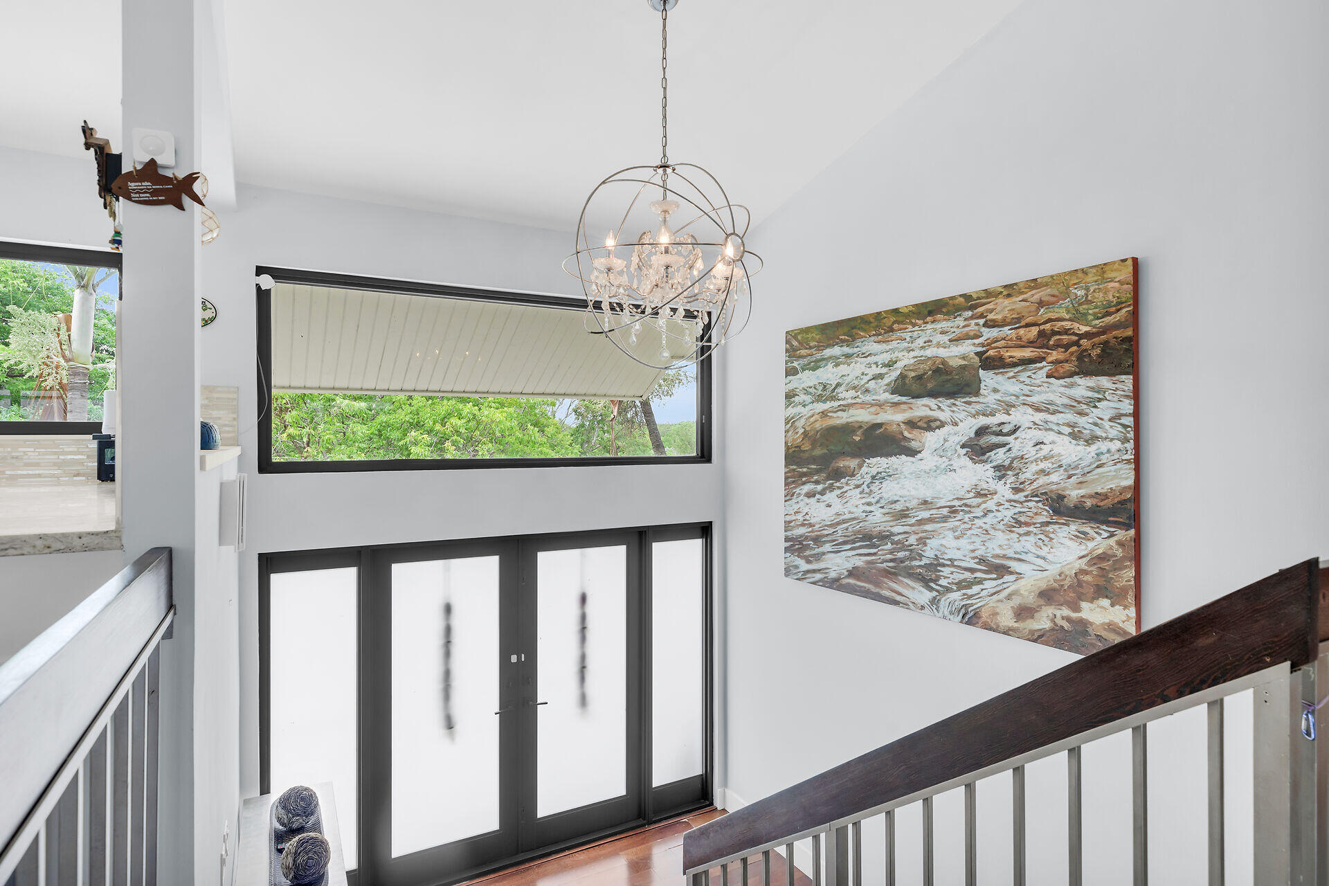 31 South Carysfort Circle Key Largo, FL 33037 - Photo 42 of 47 a view of a porch with a floor to ceiling window and stairs