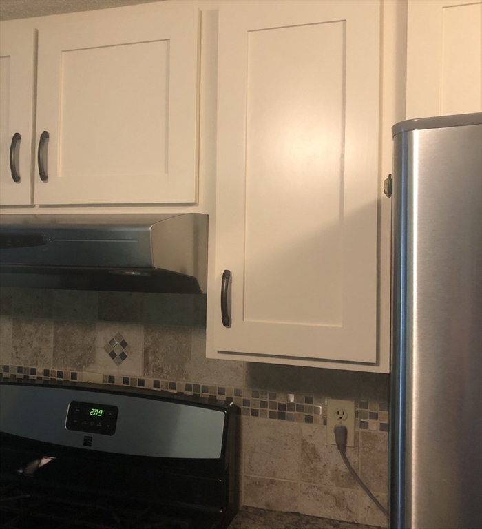 340 Trailside Way, Unit 340 Ashland, MA 01721 - Photo 9 of 39 a bathroom with a sink and a mirror