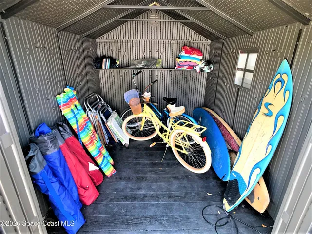 a view of swings room with furniture and toys