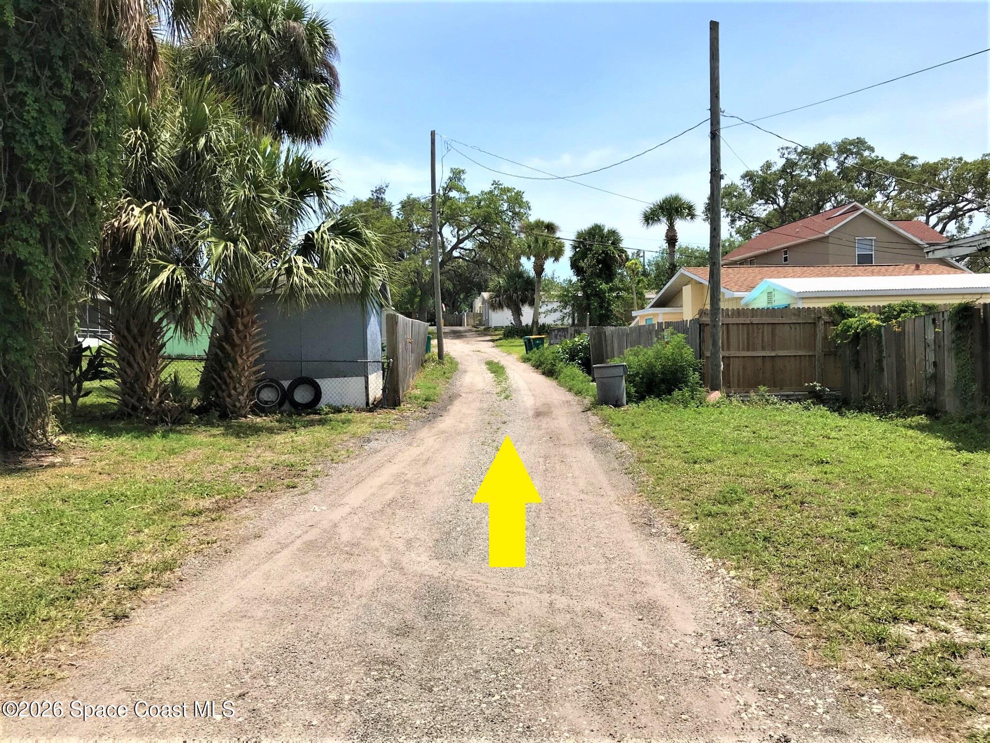 1981 Guava Avenue, Unit 104 Melbourne, FL 32935 - Photo 17 of 20 a view of a house with a yard and sitting area
