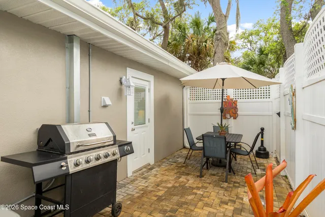 a table and chairs in a patio
