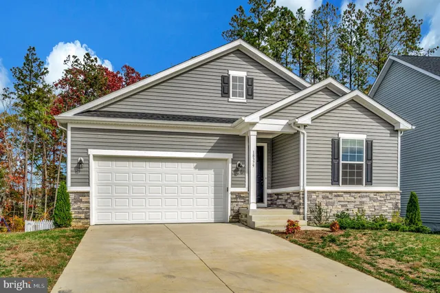 a front view of a house with a garage
