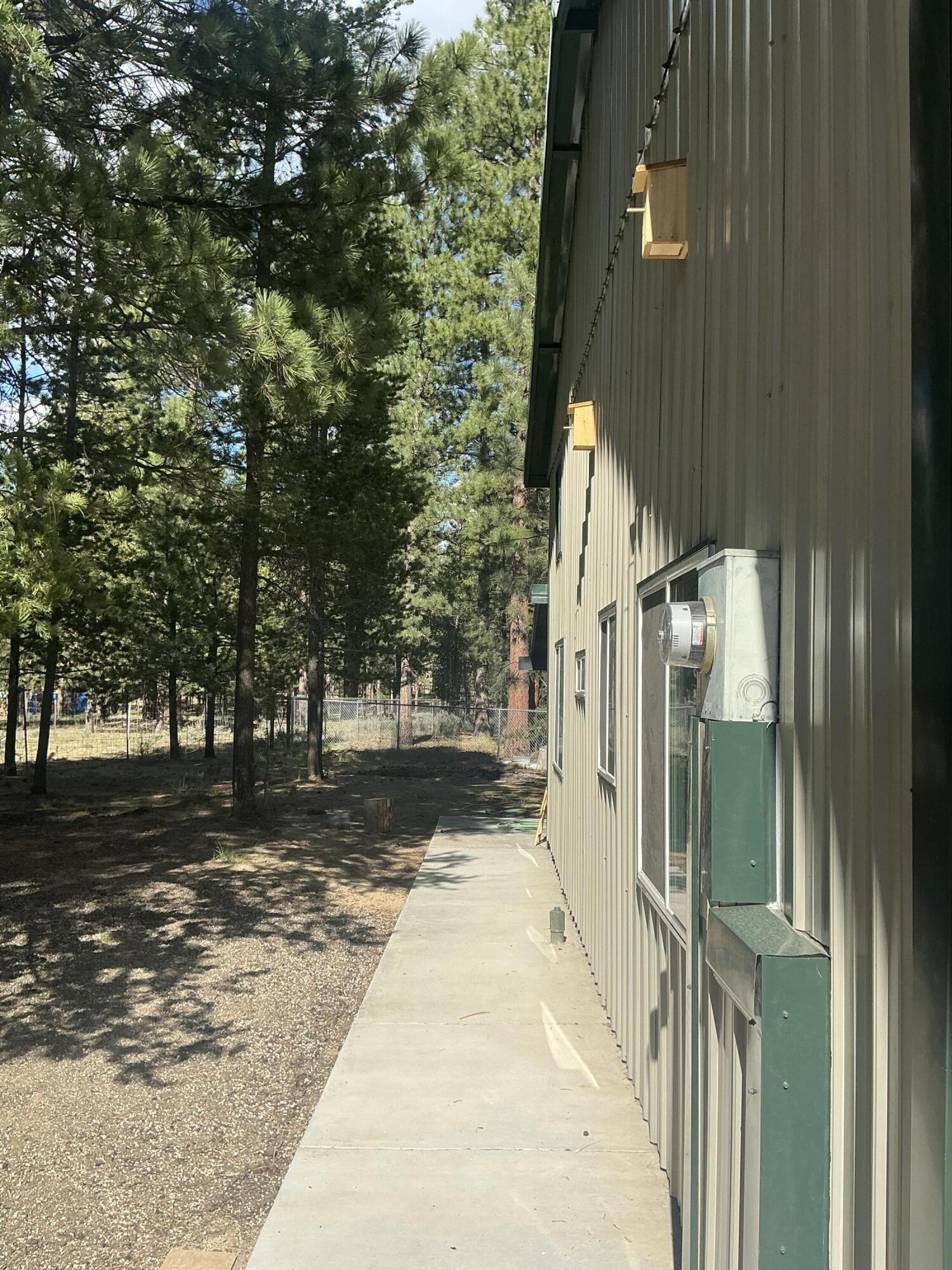 51829 Pine Loop Drive La Pine, OR 97739 - Photo 17 of 23 Left side of house walking to back patio