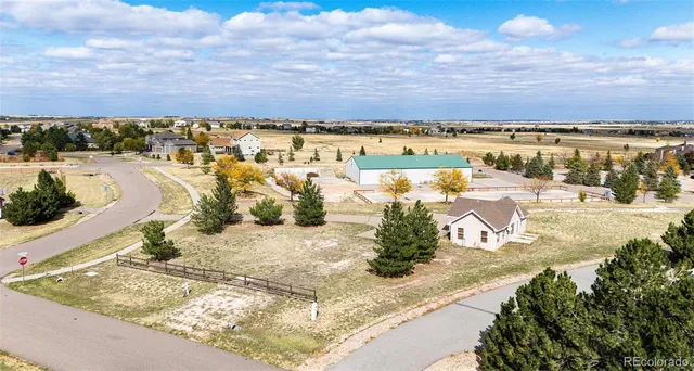 an aerial view of a large parking space and city view
