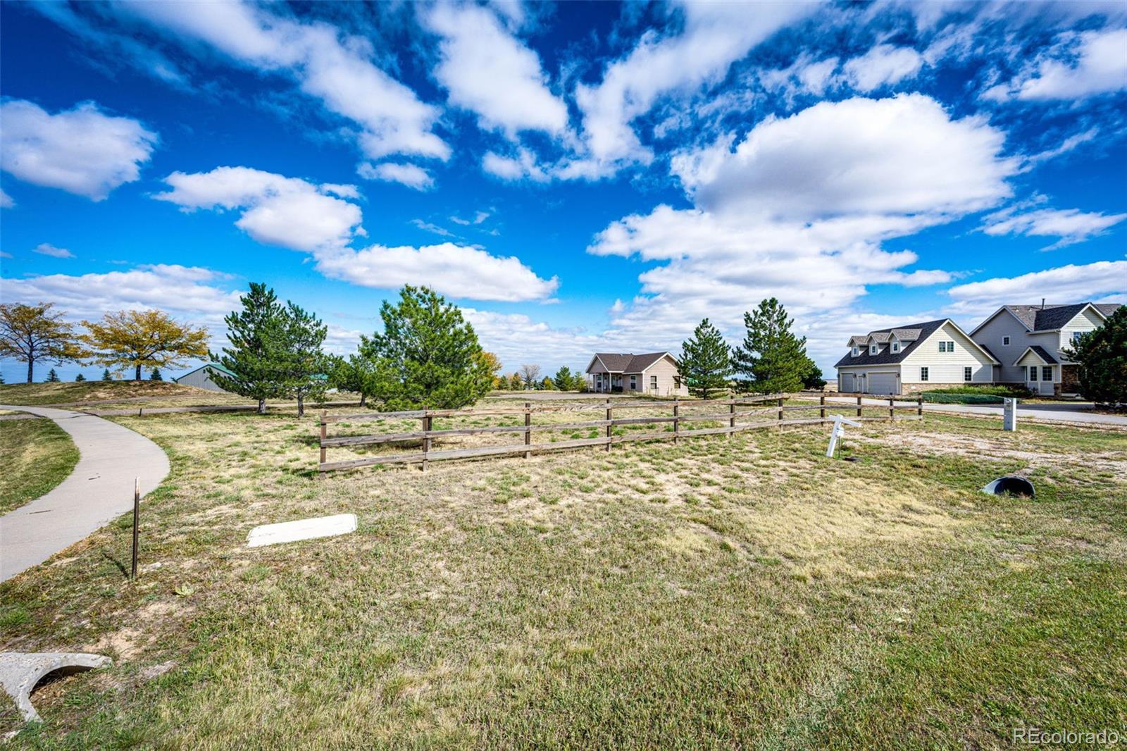 640 Green Gables Way Bennett, CO 80102 - Photo 3 of 35 a view of a swimming pool with a yard