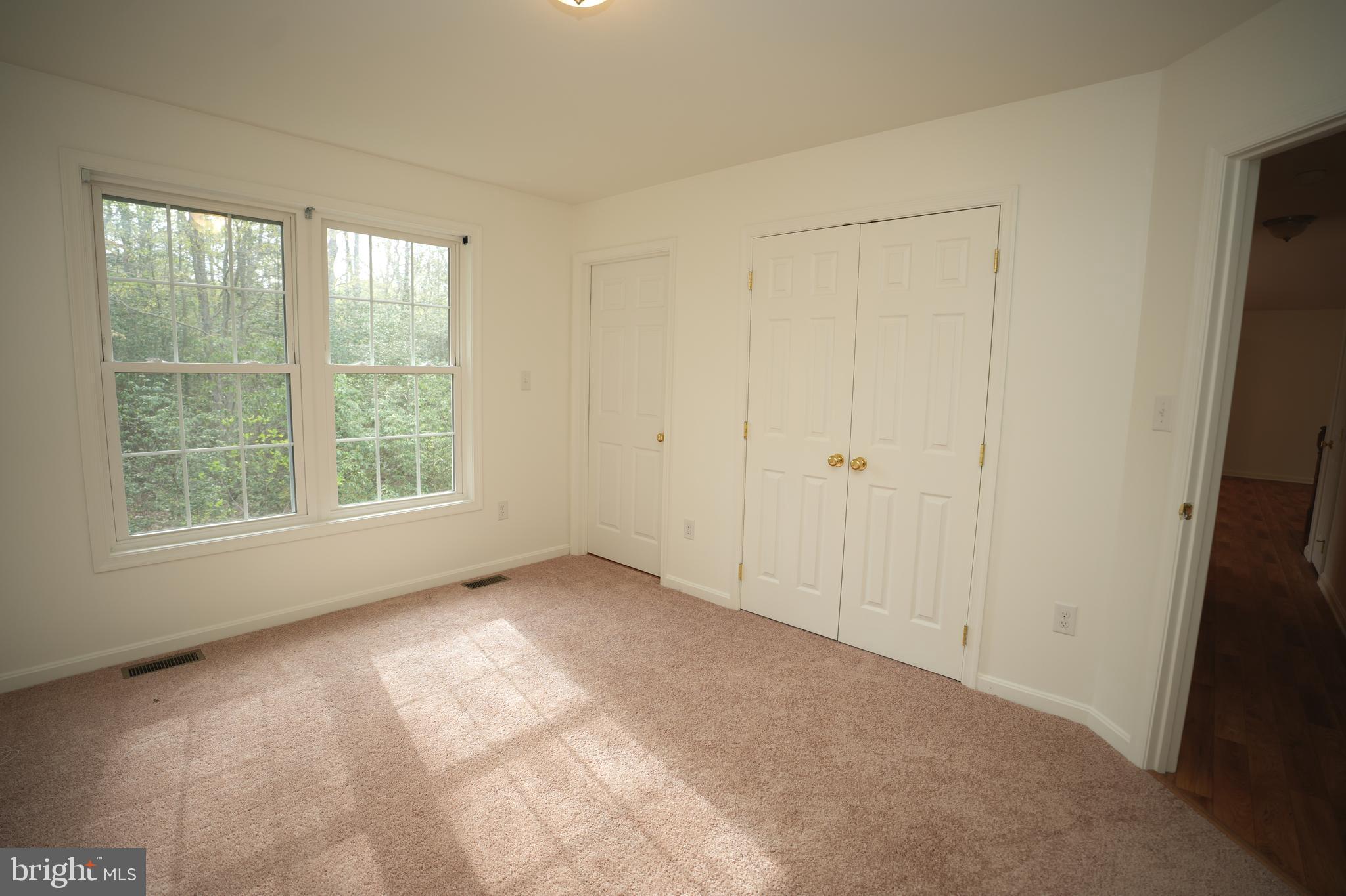 18871 Three Notch Road Lexington Park, MD 20653 - Photo 18 of 34 a view of an empty room with a window