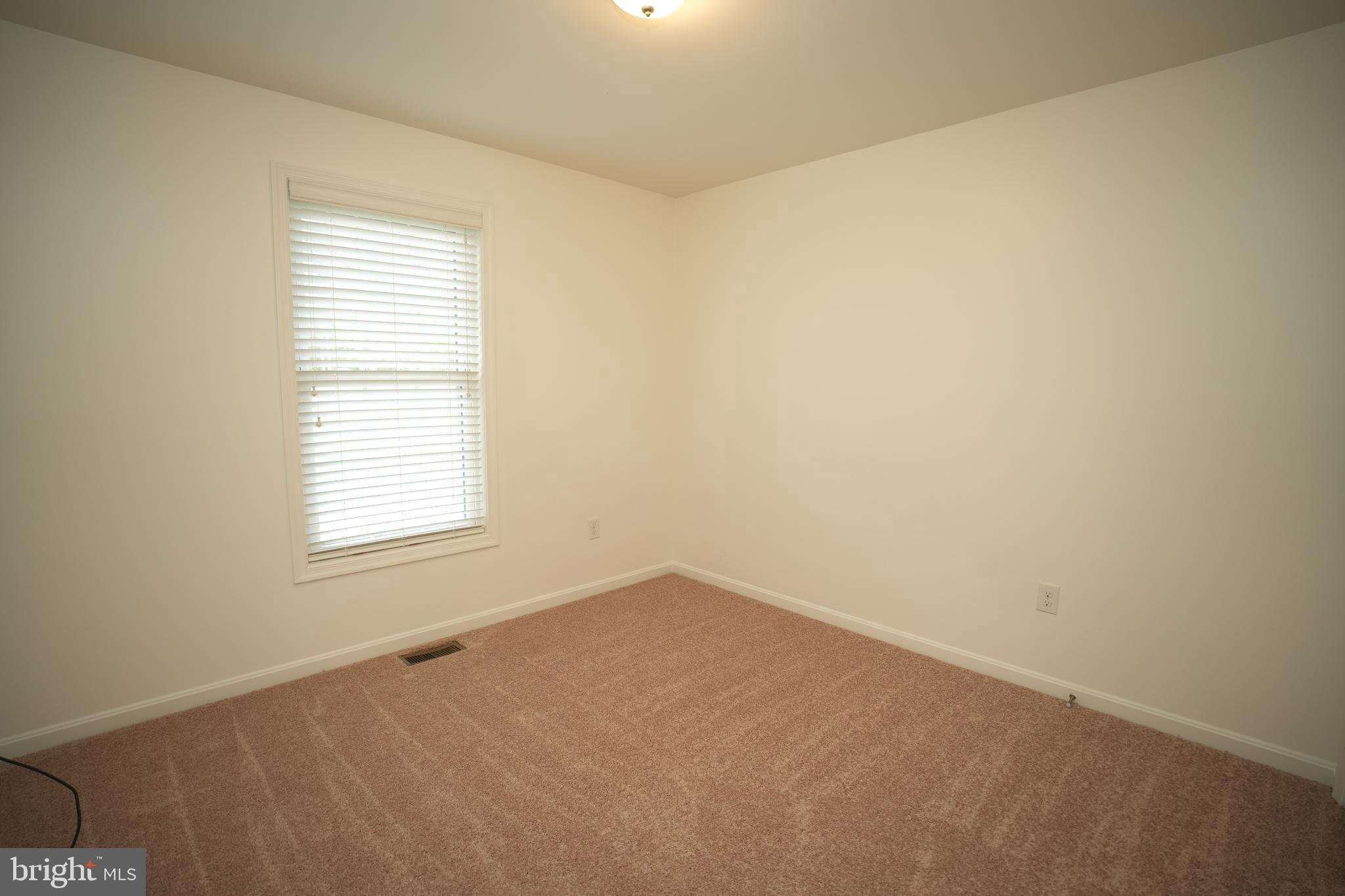 18871 Three Notch Road Lexington Park, MD 20653 - Photo 20 of 34 an empty room with a window